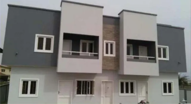 Terraced residential development at Alpha Beach, Lekki, grey and white facades